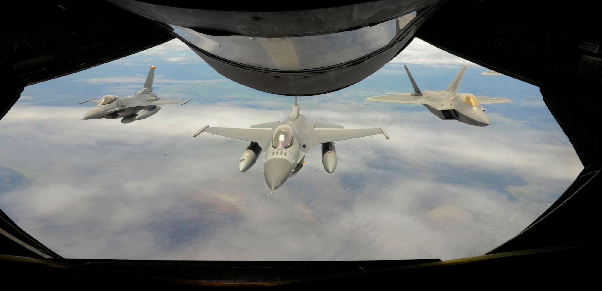 In route to the Australian International Airshow 2013, two F-16 Fighting Falcons, representing Misawa Air Base, Japan, demonstration team, and an F-22 Raptor, representing Langley Air Base, Virginia, demonstration team, fly over Australia behind a KC-135 Stratolifter, from Kadena Air Base, Okinawa, Japan on Feb. 22, 2013. The AIA13, scheduled for Feb. 26 to March 3, is the largest biennial and international trade show in the Pacific. At the airshow, a cross-section of U.S. military aircraft and equipment are scheduled to be present through static displays and aerial demonstrations, including the United States Air Force’s F-22 Raptor, C-17 Globemaster III, F-16 Fighting Falcon, B-52 Stratofortress, and KC-135 Stratotanker. Approximately 220 U.S. service members are supporting the AIA13, which represents a unique opportunity for the United States to showcase its aviation prowess and promote strong military-to-military ties with its’ Pacific friends and allies. (U.S. Air Force photo by Airman 1st Class Kenna Jackson)