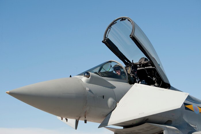A Royal Air Force Coningsby No.11 Squadron pilot performs pre-flight cockpit checks on a Typhoon aircraft in preparation for a Red Flag 13-3 training mission Feb. 25, 2013, at Nellis Air Force Base, Nev. The Typhoon is a multi-role combat aircraft, capable of being deployed in a full spectrum of air operations, from peace support to high intensity conflict. (U.S. Air Force photo by Lawrence Crespo)