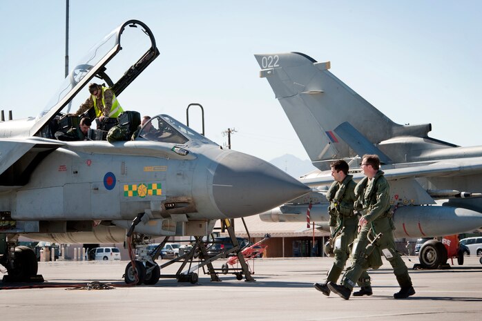 Two Royal Air Force No.12 Squadron pilots walk to a Tornado GR4 in preparation for a Red Flag 13-3 training mission Feb. 25, 2013, at Nellis Air Force Base, Nev. The RAF’s participation in Red Flag builds international air force cooperation, interoperability, and mutual support. (U.S. Air Force photo by Lawrence Crespo)