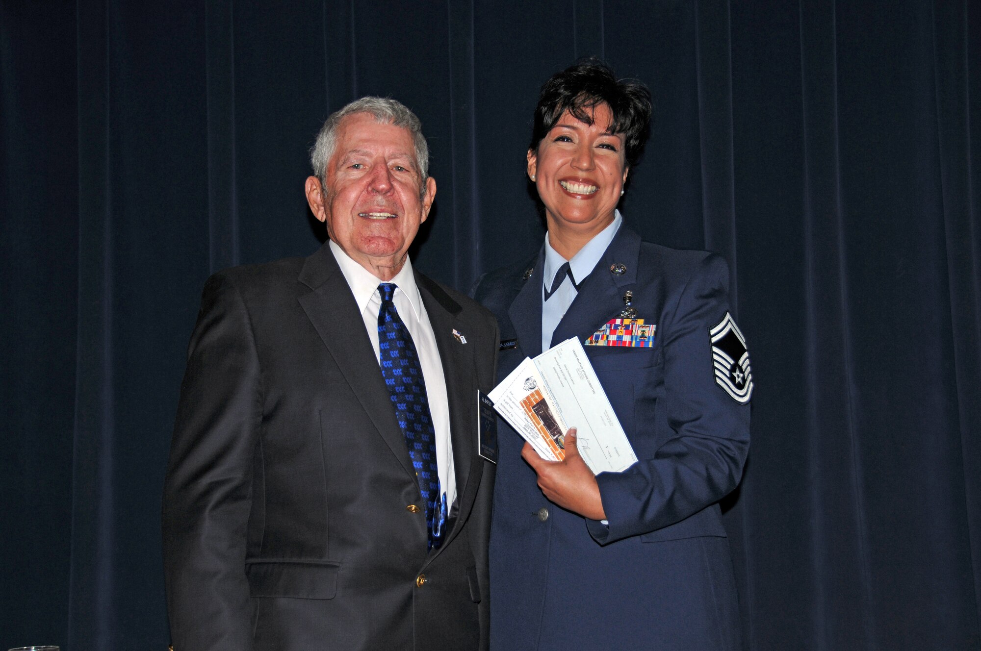 Mr. Al Shipley, Tempe Chamber of Commerce Military Affairs Committee chair presented the 2012 Graydon Williams Award to Senior Master Sgt. Gloria Portillo-Leanos, superintendent of health services, 944th Aeromedical Staging Squadron, at a recent luncheon. (U.S. Air Force photo/SSgt Joshua Nason) 
 