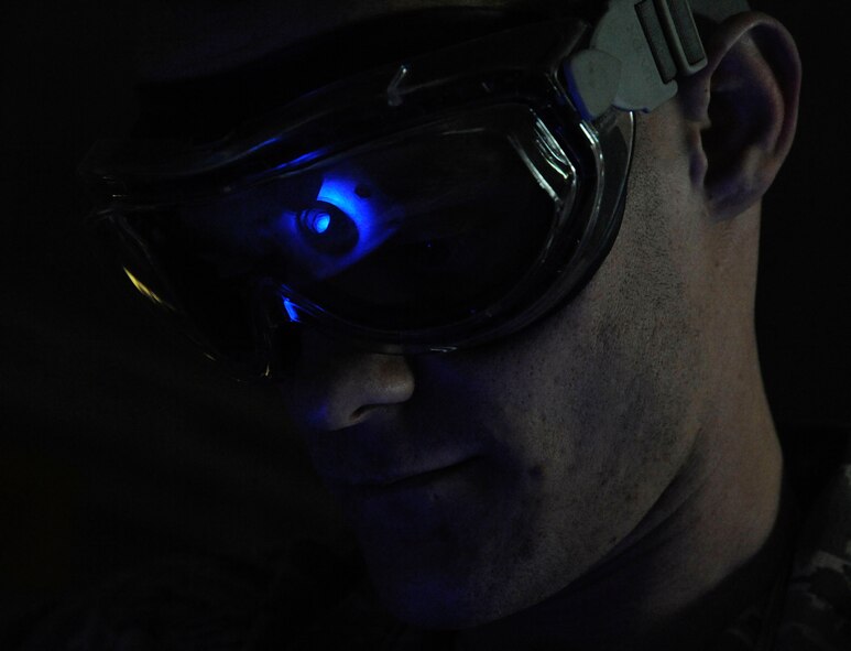 Senior Airman Brian Burkett, 2nd Maintenance Squadron non-destructive inspection, exposes a front hub to ultraviolet light during a magnetic particle inspection on Barksdale Air Force Base, La., Feb. 26. The NDI section assists 2 MXS by helping pinpoint damage to aircraft parts by using ultrasound and X-rays to find damage not visible to the naked eye. (U.S. Air Force photo/Airman 1st Class Andrew Moua)