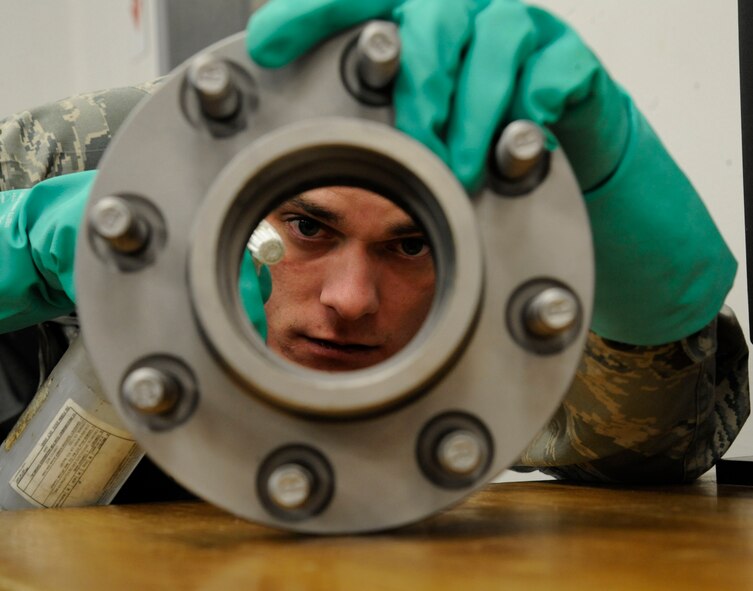 Senior Airman Brian Burkett, 2nd Maintenance Sqauadron Non-Destructive Inspection, cleans a front hub prior to a magnetic particle inspection on Barksdale Air Force Base, La., Feb. 26. Parts must be cleaned prior to inspections to ensure nothing is overlooked or missed during repairs. (U.S. Air Force photo/Airman 1st Class Andrew Moua)