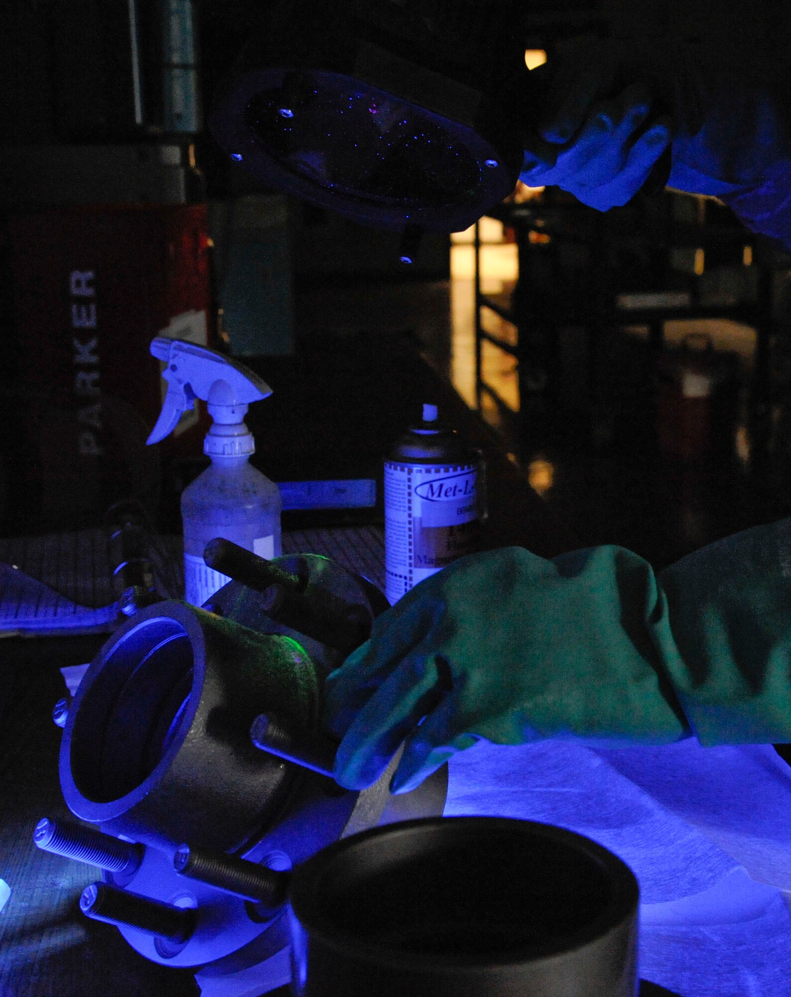 Senior Airman Brian Burkett, 2nd Maintenance Squadron Non-Destructive Inspection, conducts a magnetic particle inspection on a front hub on Barksdale Air Force Base, La., Feb. 26. The NDI section assists 2 MXS by helping pinpoint damage to aircraft parts by using ultrasound and X-rays to find damage not visible to the naked eye. (U.S. Air Force photo/Airman 1st Class Andrew Moua)