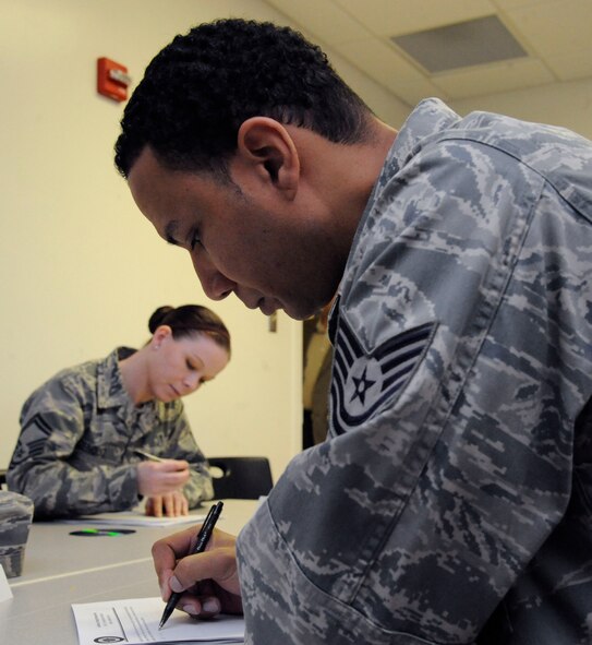 Tech. Sgt. Remy Voisin, 2nd Maintenance Squadron, writes his experience of resilience during Resilience Training Assistant training on Barksdale Air Force Base, La., Feb. 26. The class teaches various ways Airmen can be resilient: physical, mental, spiritual and social. Airmen in this class will go back to their units as RTAs and provide other Airmen the tools to balance out all forms of resiliency. (U.S. Air Force photo/Airman 1st Class Andrew Moua)