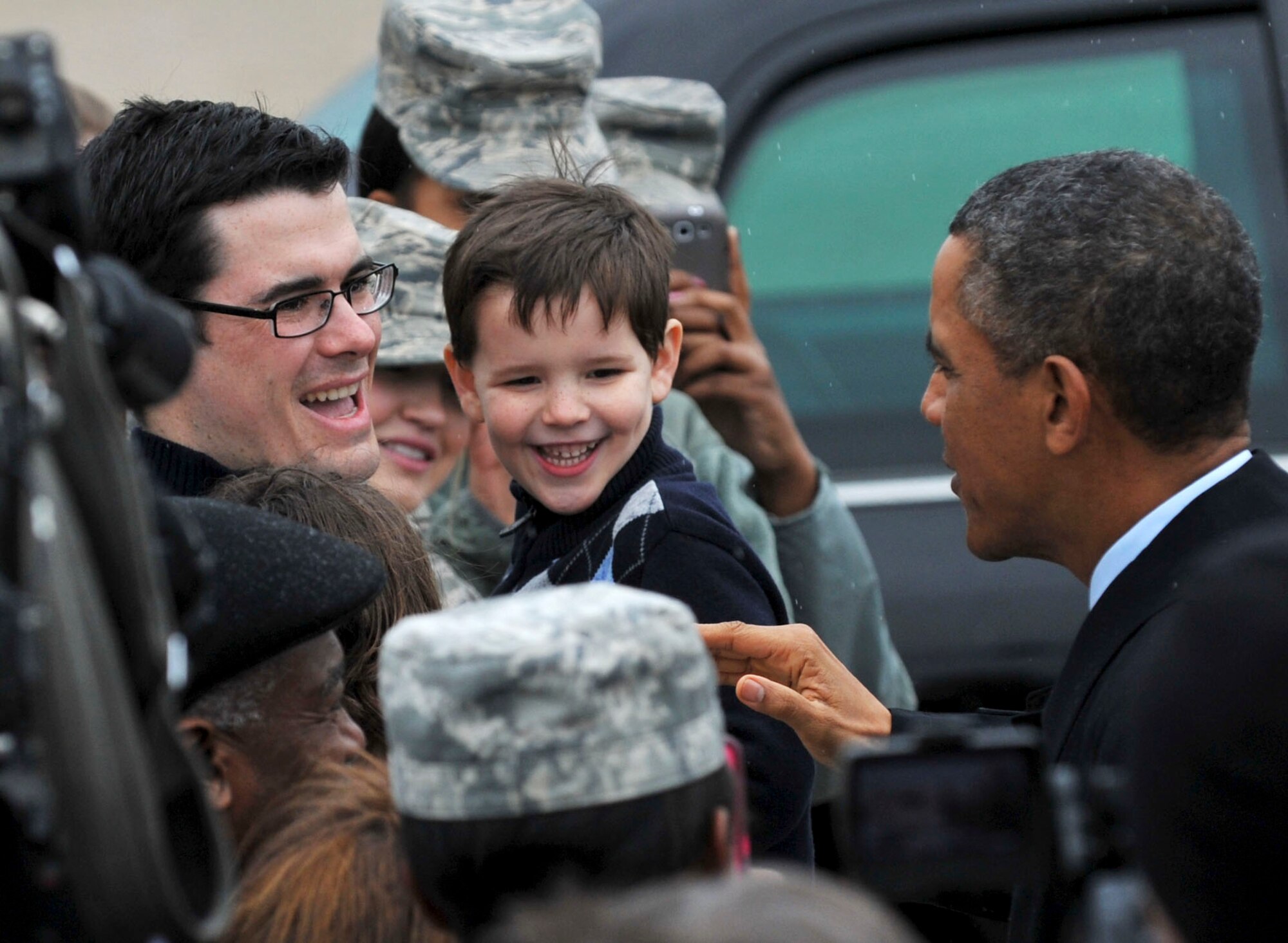 President Barack Obama greets crowd members at Langley Air Force Base, Va., Feb. 26, 2013. The president shook hands with Service members and families from Langley before his visit to a Newport News, Va., shipyard. (U.S. Air Force photo by Staff Sgt. Katie Gar Ward/Released)