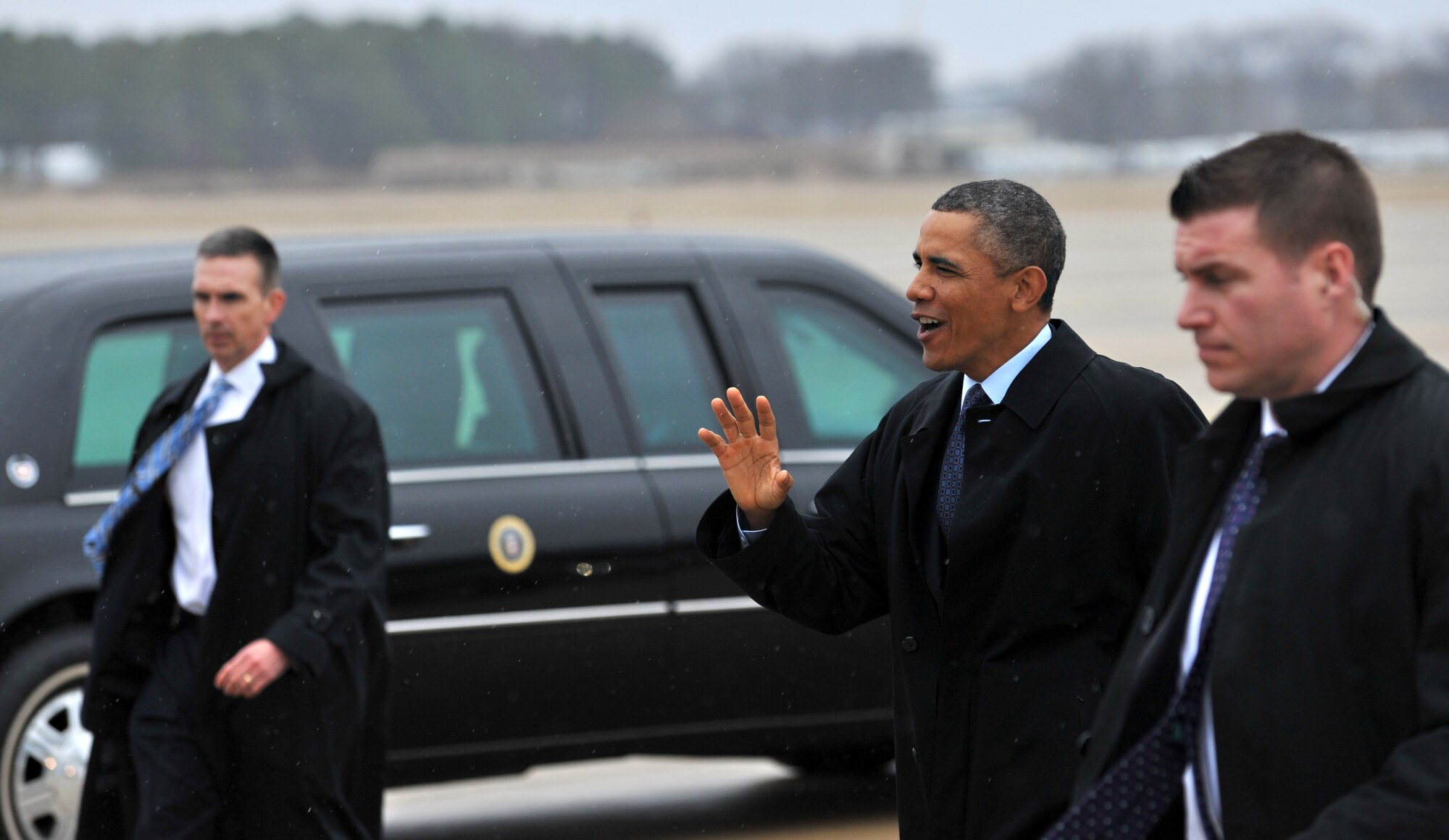 President Barack Obama walks over to a crowd after exiting Air Force One on Langley Air Force Base, Va., Feb. 26, 2013. The president visited a Newport News, Va., shipyard to discuss current fiscal concerns and sequestration. (U.S. Air Force photo by Staff Sgt. Katie Gar Ward/Released) 