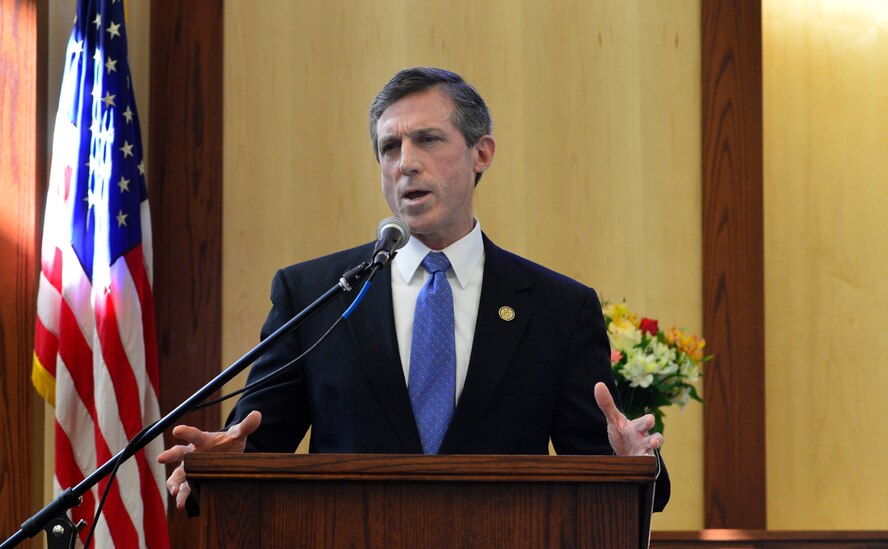 U.S. Rep. John Carney of Delaware, speaks at the ribbon cutting ceremony for the new base chapel Feb. 25, 2013, at Dover Air Force Base, Del. The new $8.7 million dollar facility will serve to meet the spiritual needs of Team Dover. (U.S. Air Force photo/David Tucker)