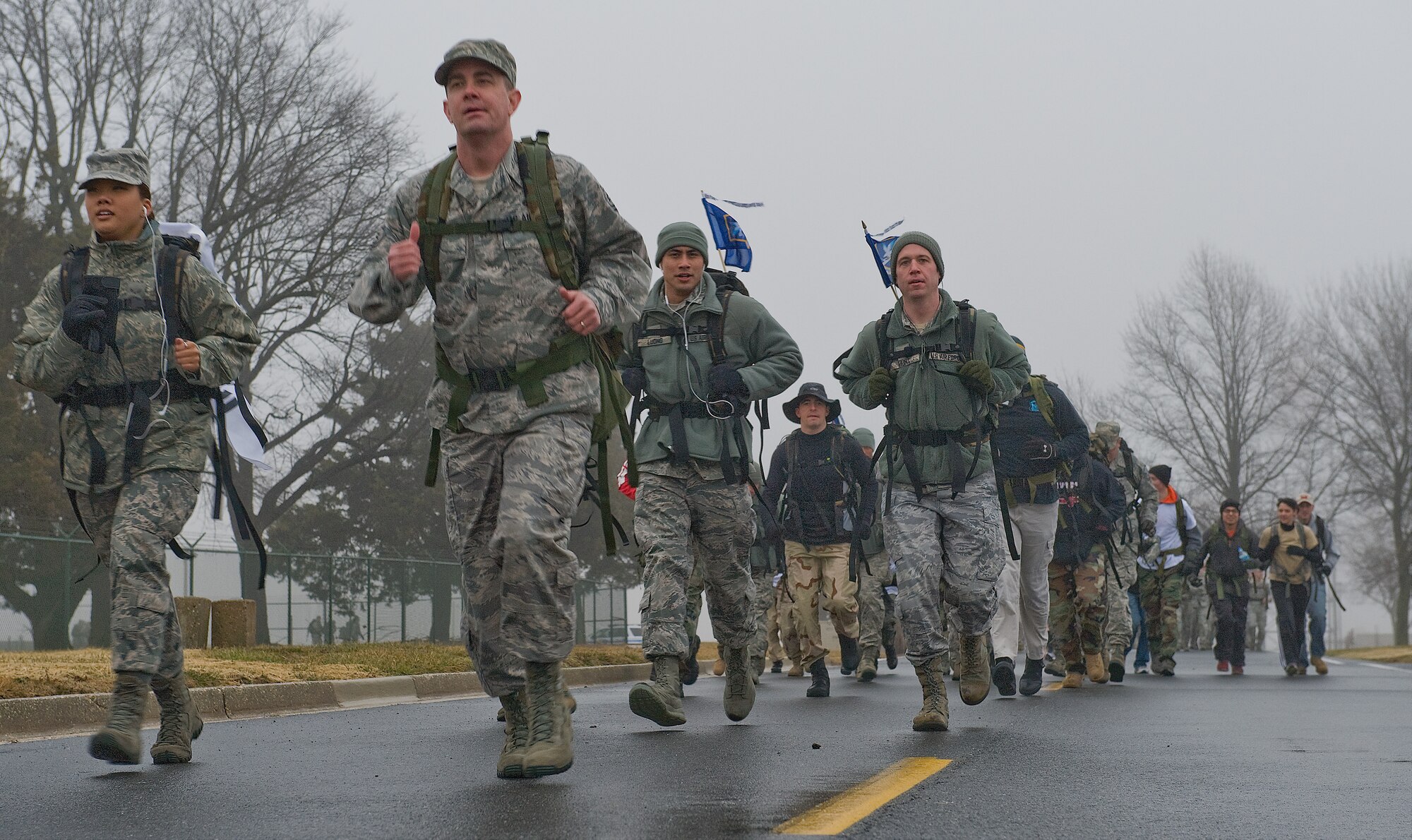 Members of Team Dover race off the starting line of the 14th Annual Korean War Ruck March Feb. 23, 2013, at Dover Air Force Base, Del. The march was held to commemorate the “Chosin Few” – American service members who fought at the Battle of Chosin Reservoir during the Korean War – who braved subfreezing temperatures and brutal combat that resulted in approximately 40,000 Chinese casualties. (U.S. Air Force photo/Senior Airman Sam Taylor)  
