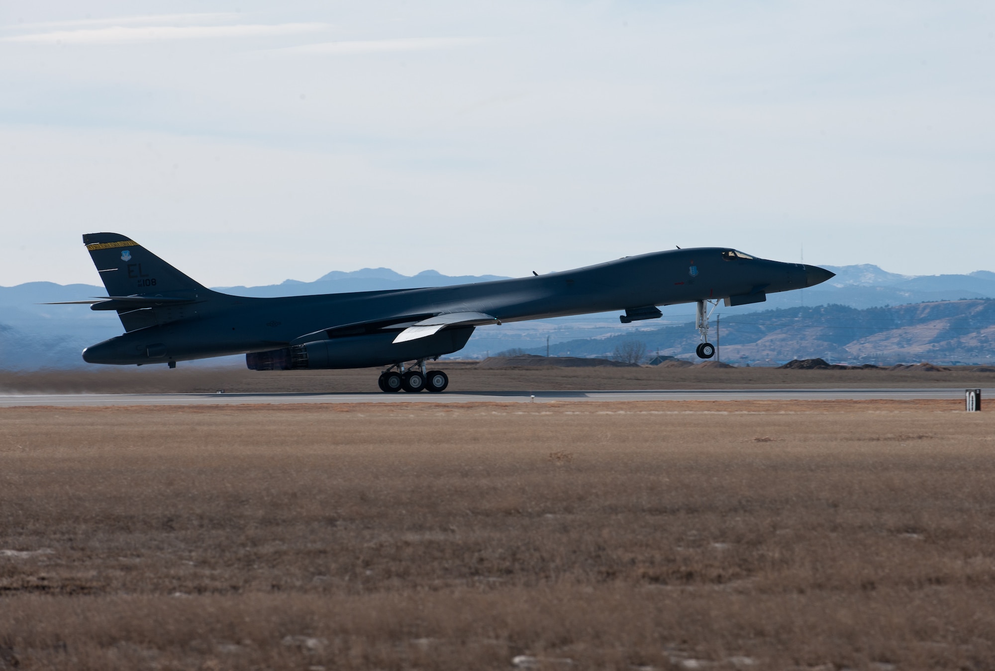 A B-1 bomber takes off following a successful hot pit refuel at Ellsworth Air Force Base, S.D., Feb. 12, 2013. By keeping the B-1 running in between sorties, the aircrew is able to get more flying hours without any maintenance downtime. (U.S. Air Force photo by Airman 1st Class Alystria Maurer/Released)