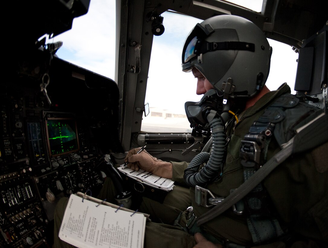 Lt. Col. Barry Hutchinson, 28th Bomb Wing chief of plans, records control readings during a hot pit refuel of a B-1 bomber at Ellsworth Air Force Base, S.D., Feb. 12, 2013. Hot pit refueling, usually performed in a combat environment, is a carefully controlled process during which two engines continue running, which reduces maintenance turn time for the aircraft. (U.S. Air Force photo by Airman 1st Class Alystria Maurer/Released)