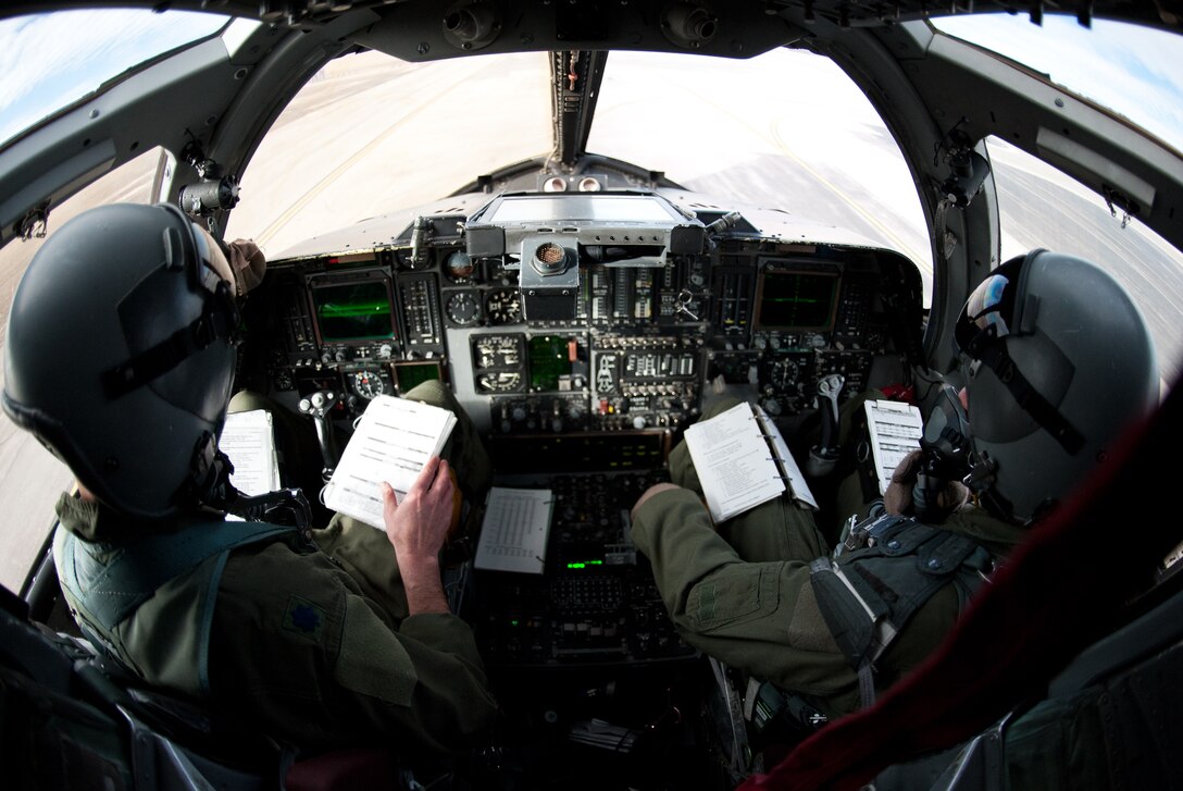 Lt. Col. Brian Mead (left), 28th Operations Group deputy commander, and Lt. Col. Barry Hutchinson, 28th Bomb Wing chief of plans, complete pre-flight checks on a B-1 bomber during hot pit refueling at Ellsworth Air Force Base, S.D., Feb. 12, 2013. The ability to perform hot pit refueling increases the unit’s capability to meet sortie generation and training requirements. (U.S. Air Force photo by Airman 1st Class Alystria Maurer/Released)
