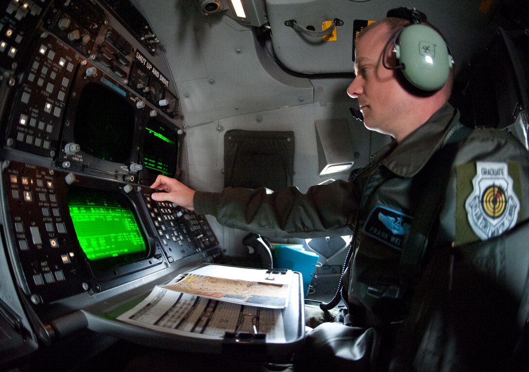 Maj. Frank Welton, 28th Operations Support Squadron assistant director of operations, checks controls during a hot pit refueling procedure on a B-1 bomber at Ellsworth Air Force Base, S.D., Feb. 12, 2013. Hot pit refueling is a carefully controlled process performed while engines are running, resulting in faster aircraft regeneration. (U.S. Air Force photo by Airman 1st Class Alystria Maurer/Released)