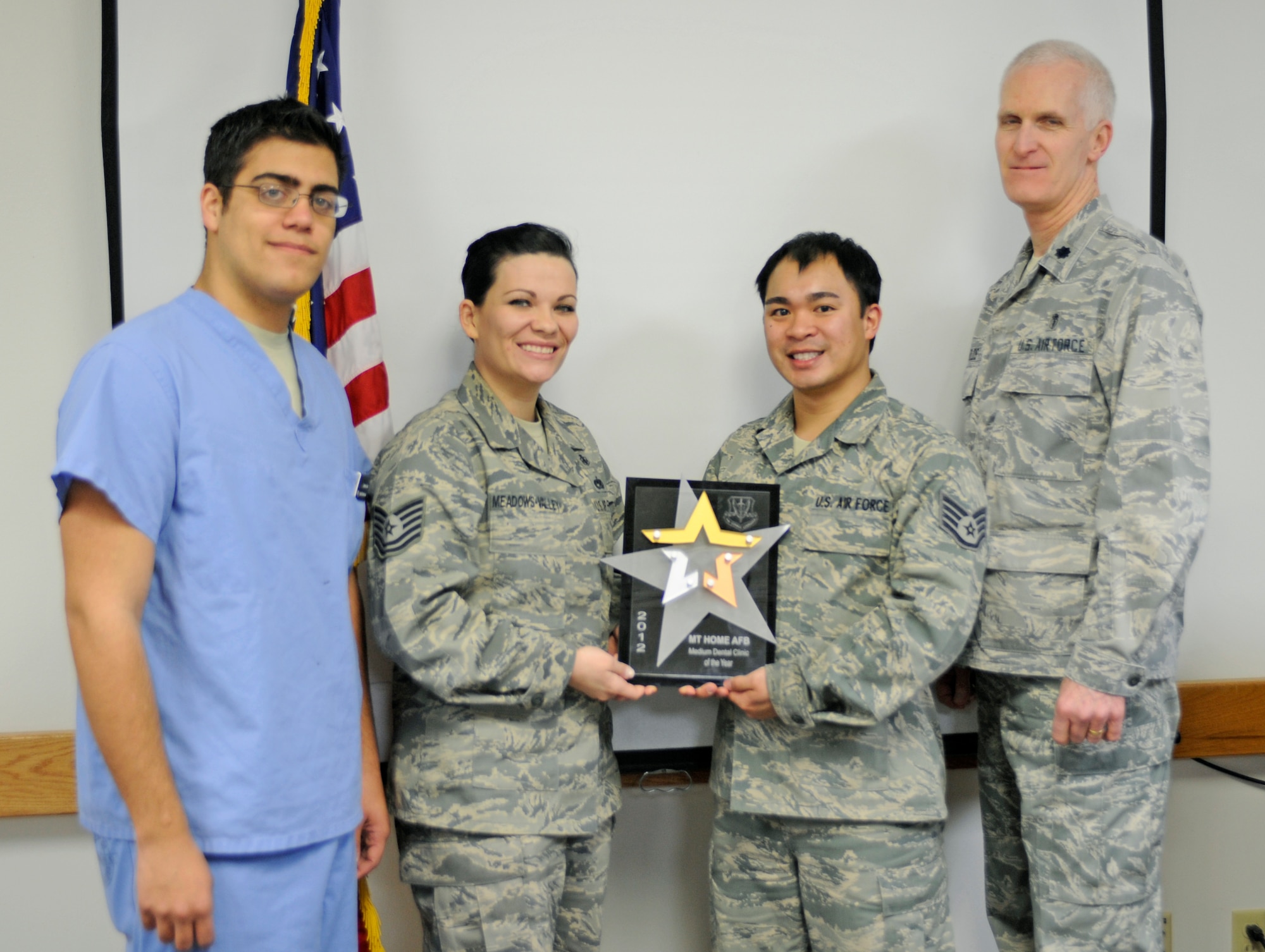U.S. Air Force members of the 366th Medical Group Aerospace Medicine Squadron’s Dental Clinic, rejoice after earning the Air Combat Command title of Best Medium Dental Clinic of the Year, Feb. 20, 2013, at Mountain Home Air Force Base, Idaho. The prestigious award was officially announced in December, highlighting a year of exemplary work and dedication by MHAFB dental personnel. (U.S. Air Force photo/Airman 1st Class Shane M. Phipps)


