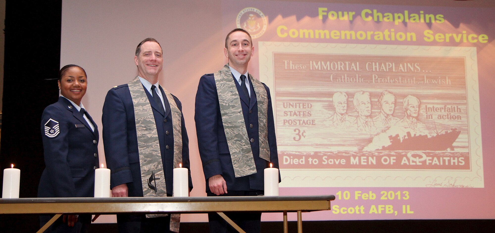 The 932nd Airlift Wing chaplains hosted the "Four Chaplains" commemoration service which highlighted the selfless contributions made by the four chaplains during World War II. The chaplains were aboard an Army troop carrier ship when it was struck by torpedoes from enemy submarines. From left, are Master Sgt. Dee Clark-Riley, chaplain assistant; Chaplain (Maj). Howard Bell and Chaplain (First Lt.) Michael Williams. (U.S. Air Force photo/Tech. Sgt. Christopher Parr)