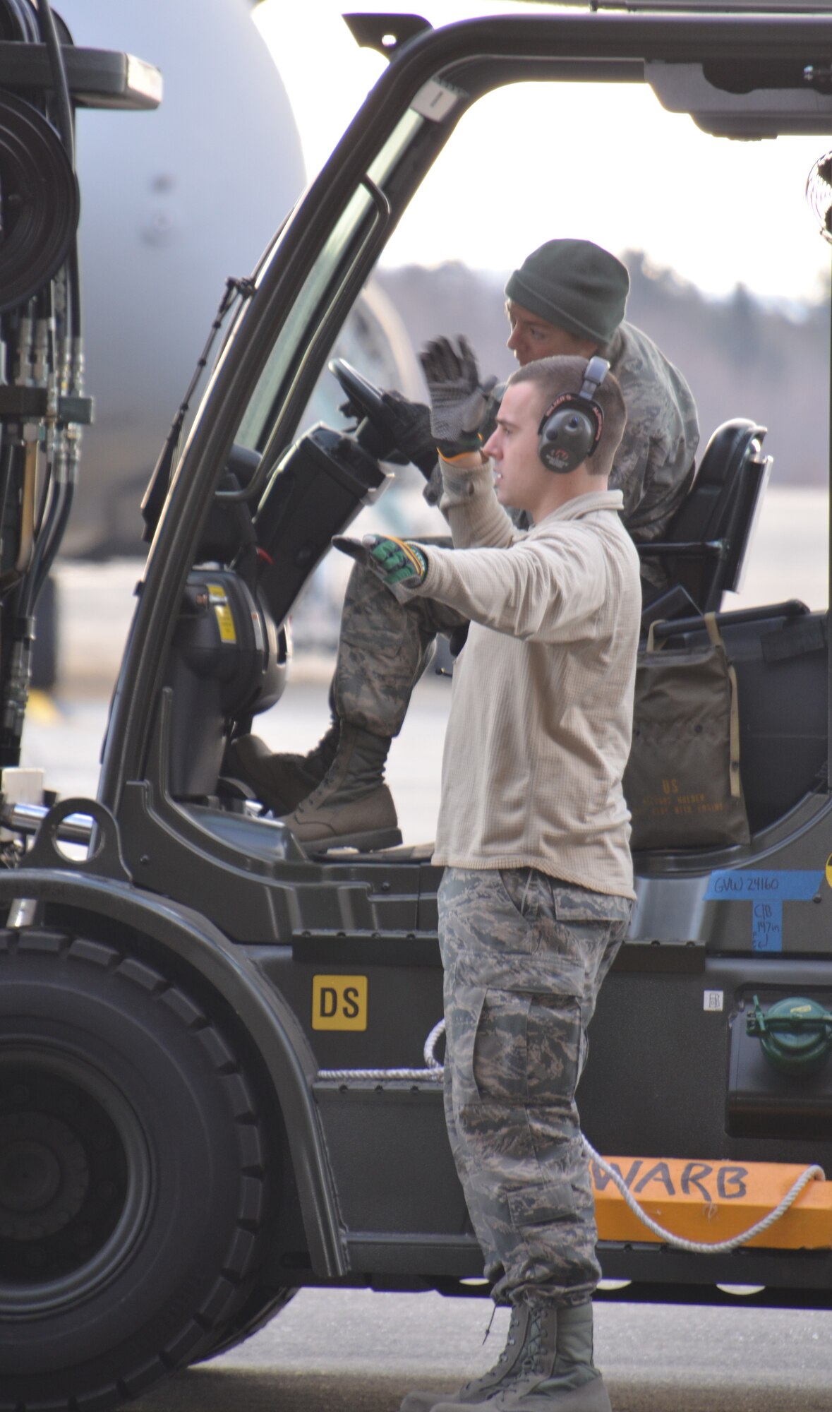 SrA. David Boido helps guide MSgt. Lori Rysedorph with loading cargo aboard a K-loader at Westover Feb. 21. The Airmen, assigned to the 58th Aerial Port Squadron, are part of the Patriot Sands 2013 exercise that began at MacDill Air Force Base, Fla., Feb. 22. (US Air Force photo/MSgt. Andrew Biscoe)