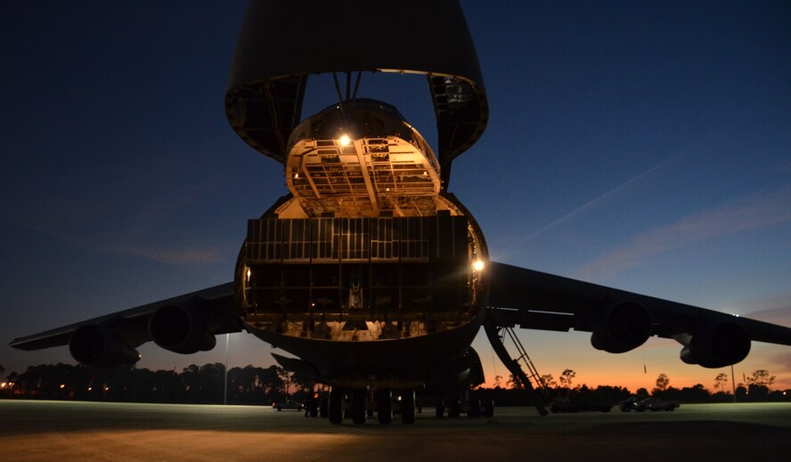 A Florida sunset backdrops the Westover C-5B Feb. 21 at MacDill Air Force Base. Patriot Wing Airmen flew aboard the Galaxy along with more than 70,000 pounds of cargo for Patriot Sands 2013. (US Air Force photo/MSgt. Andrew Biscoe)