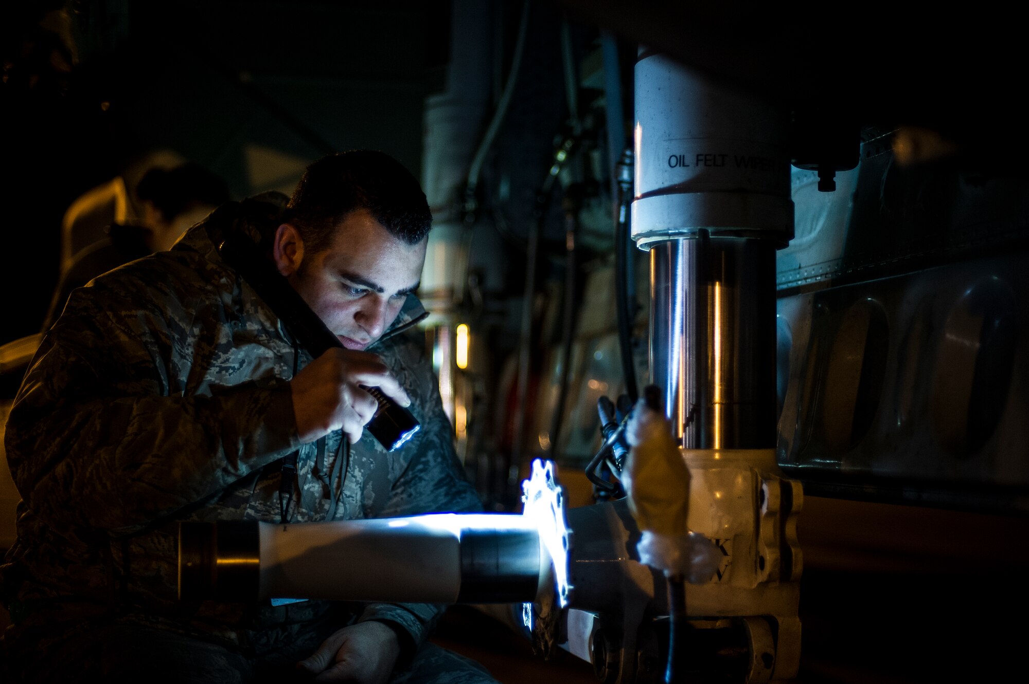 U.S. Air Force Senior Airman Fernando Kossler, a crew chief at the 4th Aircraft Maintenance Unit, inspects a brake hub before replacing the brakes on an AC-130U gunship at the flightline on Hurlburt Field, Fla., Feb. 20, 2013. Maintenance personnel consisting of crew chiefs with a complement of systems technicians, augmented by Airmen from the 1st Special Operations Component Maintenance Squadron and 1st Special Operations Equipment Maintenance Squadron, normally accompany deployed aircraft. (U.S. Air Force photo/Airman 1st Class Christopher Callaway)