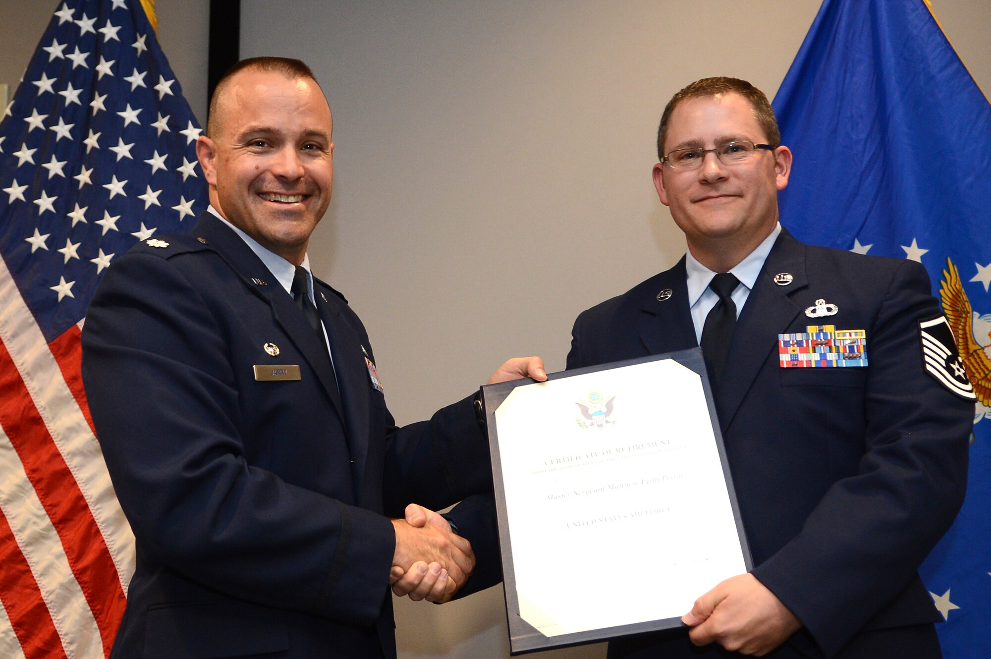U.S. Air Force Master Sgt. Matthew Pettitt, 28th Operational Weather Squadron flight chief, receives his certificate of appreciation during his retirement at Shaw Air Force Base, S.C., Feb.  22, 2013.  Pettitt served for 20 years in the Air Force and had 10 assignments. For three of those years, he served at the 28th OWS here. (U.S. Air Force photo by Airman 1st Class Nicole Sikorski/Released)