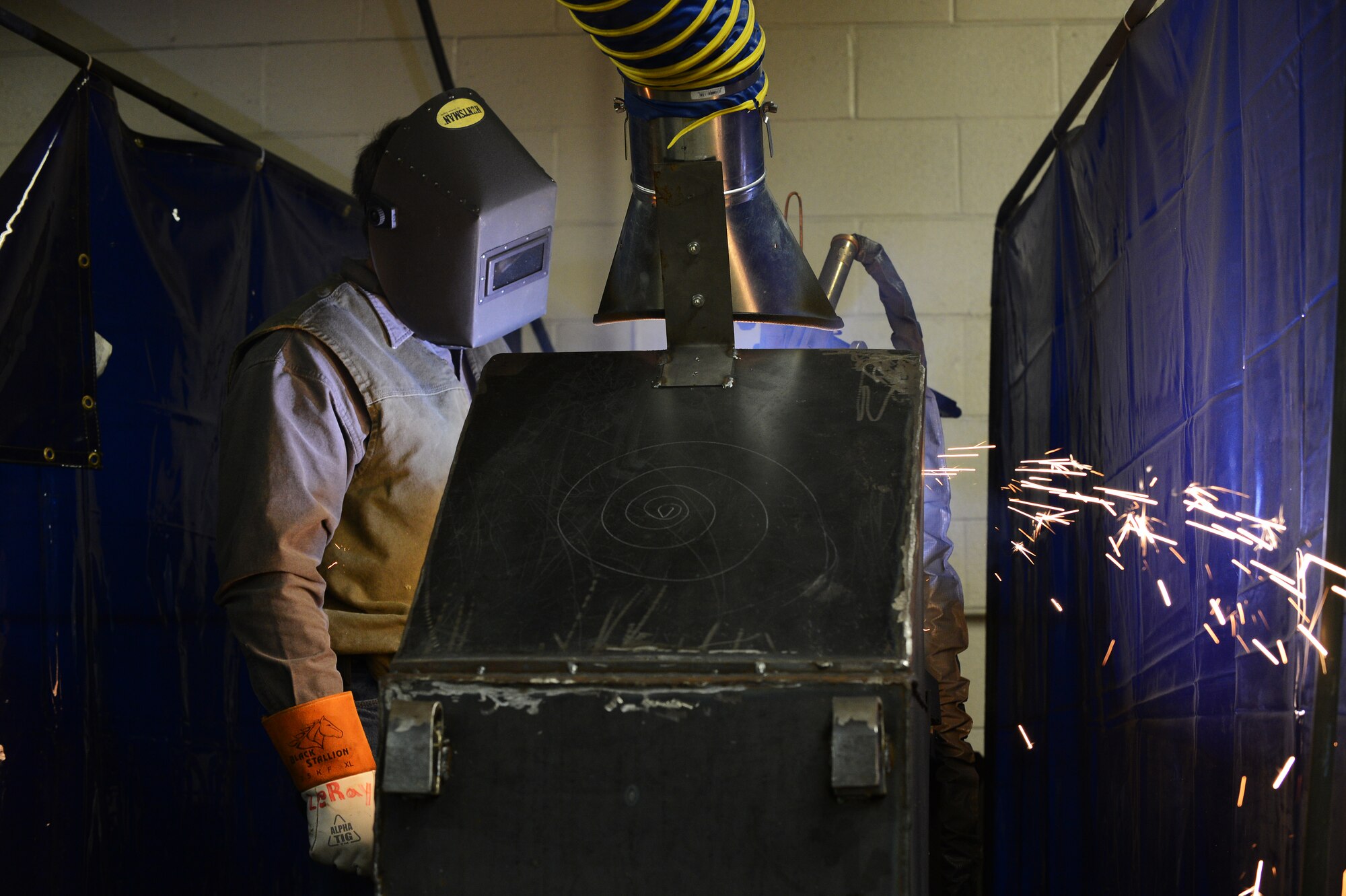 A Central Carolina Technical College student welds a v-grooved plate during his structural welding class in Sumter, S.C., Feb. 20, 2013.  U.S. Air Force Master Sgt. Ret. Walter Lumbert, aerospace ground equipment technician, who served for 18 years at Shaw, now instructs the course at CCTC.  Lumbert attained his certification while enlisted and upon his retirement was offered the position to build up the welding program at CCTC. (U.S. Air Force photo by Airman 1st Class Nicole Sikorski/Released)