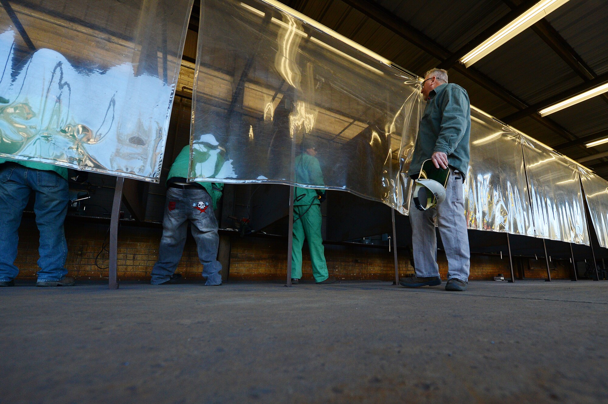 U.S. Air Force Master Sgt. Ret. Walter Lumbert, aerospace ground equipment technician, oversees his structural welding class at Central Carolina Technical College, Sumter, S.C., Feb. 20, 2013. Lumbert, who served for 18 years at Shaw, now instructs the course at CCTC.  Lumbert attained his certification while enlisted and upon his retirement was offered the position to build up the welding program at CCTC. (U.S. Air Force photo by Airman 1st Class Nicole Sikorski/Released)