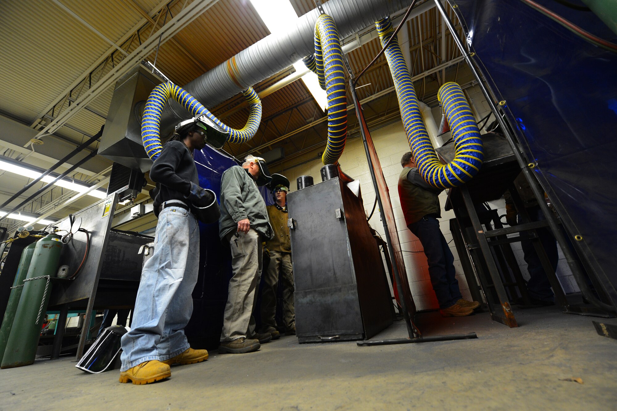 U.S. Air Force Master Sgt. Ret. Walter Lumbert, aerospace ground equipment technician, oversees his structural welding class at Central Carolina Technical College, Sumter, S.C., Feb. 20, 2013. Lumbert, who previously served for 18 years at Shaw, now instructs the course at CCTC.  Lumbert attained his certification while enlisted and upon his retirement was offered the position to build up the welding program at CCTC. (U.S. Air Force photo by Airman 1st Class Nicole Sikorski/Released)