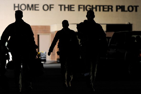 79th Fighter Squadron ‘Tigers’ pilots walk to their F-16 Fighting Falcons in preparation for a night mission during day one of Red Flag 13-3, Feb. 25, 2013. The ‘Tigers’ launched a total of 16 times during day and nighttime missions to kick off the exercise. The unit has approximately 15 F-16 Fighting Falcons on the ground at Nellis AFB and 35 pilots slated to fly throughout the three-week long exercise. (U.S. Air Force photo by Staff Sgt. Kenny Holston/Released)