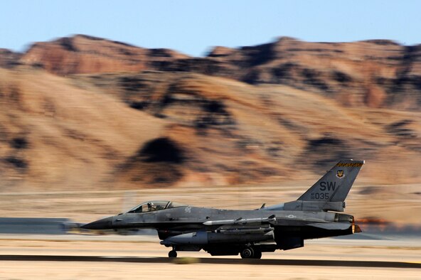 A 79th Fighter Squadron ‘Tigers’ F-16 Fighting Falcon races down the Nellis AFB runway as it takes off for the first of several missions during day one of Red Flag 13-3, Feb. 25, 2013. The ‘Tigers’ launched a total of 16 times during day and nighttime missions to kick off the exercise. The unit has approximately 15 F-16 Fighting Falcons on the ground at Nellis AFB and 35 pilots slated to fly throughout the three-week long exercise. (U.S. Air Force photo by Staff Sgt. Kenny Holston/Released)