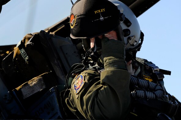 A 79th Fighter Squadron ‘Tigers’ pilot looks toward the rear of his F-16 Fighting Falcon from the cockpit of the aircraft while communicating with his crew chief prior to takeoff during day one of Red Flag 13-3, Feb. 25, 2013. The ‘Tigers’ launched a total of 16 times during day and nighttime missions to kick off the exercise. The unit has approximately 15 F-16 Fighting Falcons on the ground at Nellis AFB and 35 pilots slated to fly throughout the three-week long exercise. (U.S. Air Force photo by Staff Sgt. Kenny Holston/Released) 