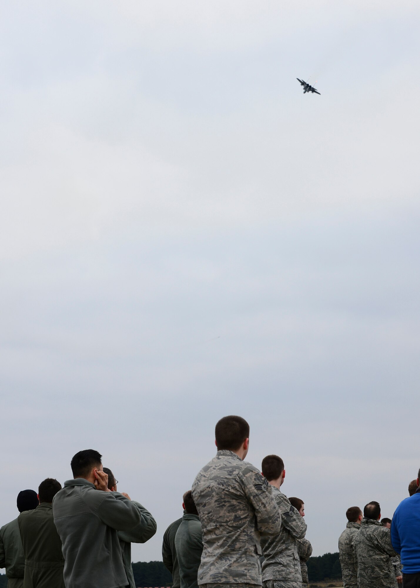 ROYAL AIR FORCE LAKENHEATH, England – Airmen from RAFs Lakenheath and Mildenhall watch an F-15C Eagle take-off during the 48th Operations Group immersion Feb. 22, 2013. Airmen were given the opportunity to see how their job enables the 48th OG to accomplish its mission. (U.S. Air Force photo by Staff Sgt. Stephanie Mancha)