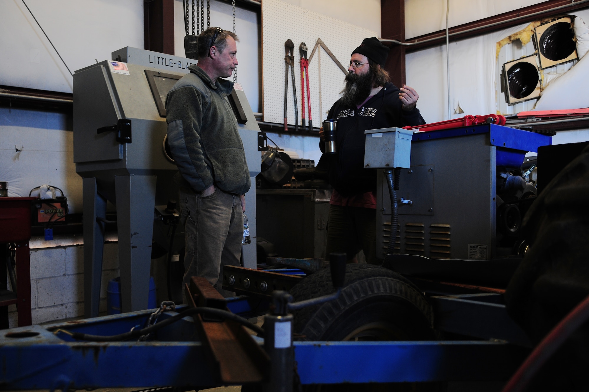 Timothy Edwards, 4th Fighter Wing ground safety manager, and David Carroll, Air Combat Command Dare County Bombing Range environmental control operator, speak about safety regulations during an inspection at the range in Stumpy Point, N.C., Feb. 21, 2013. On a regular basis, Edwards ensures flammables and overall maintenance of the range buildings meet fire safety standards. (U.S. Air Force photo/Airman 1st Class Aubrey White/Released)