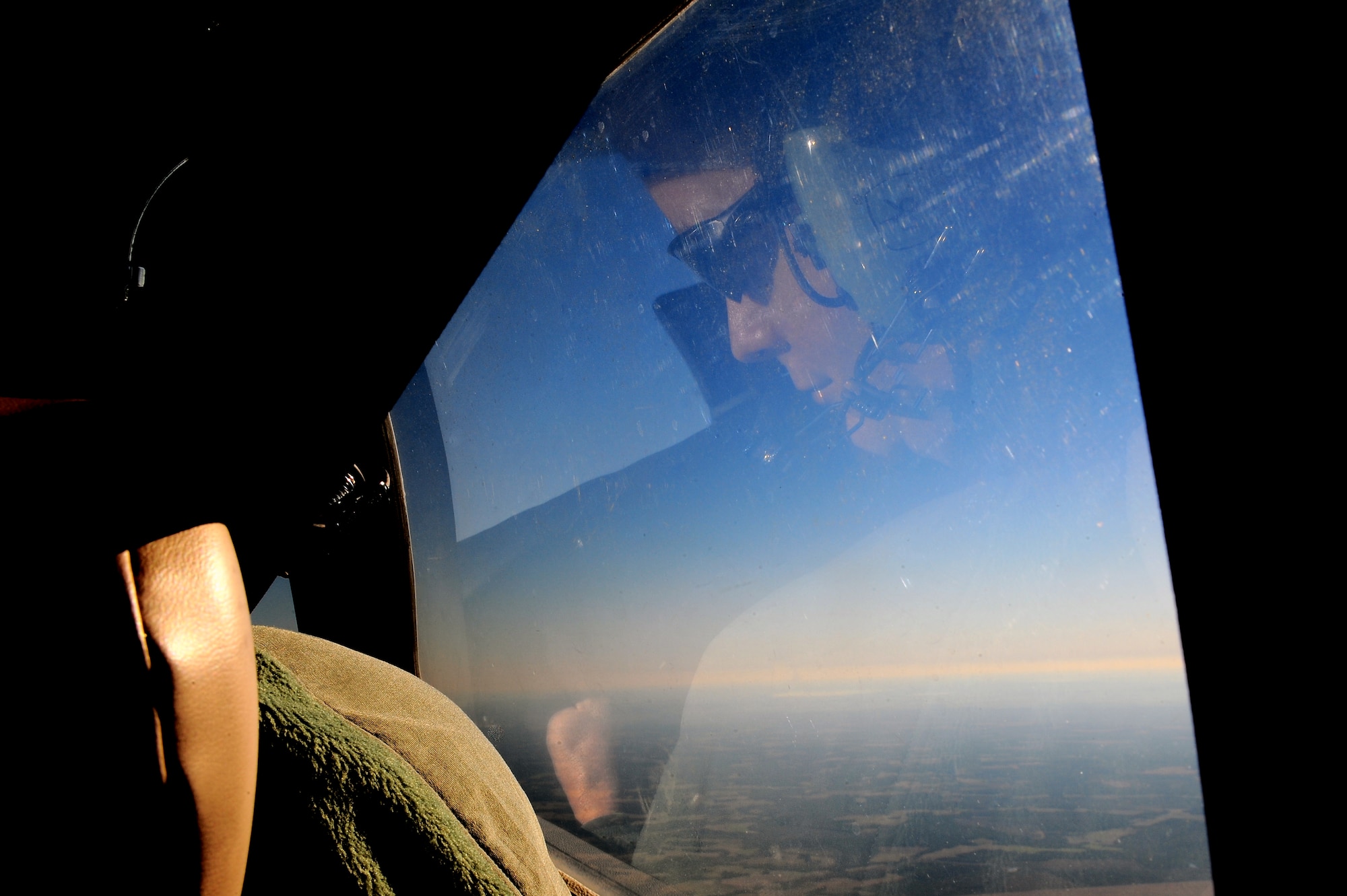 U.S. Air Force Master Sgt. Gerald Wroblewski, 4th Fighter Wing weapons safety superintendent, scans the horizon over eastern North Carolina during a flight to Dare County Bombing Range, Feb. 21, 2013. Safety office representatives visit the range at least once a year for an annual inspection to ensure contractors are complying with safety measures. (U.S. Air Force photo/Airman 1st Class Aubrey White/Released)