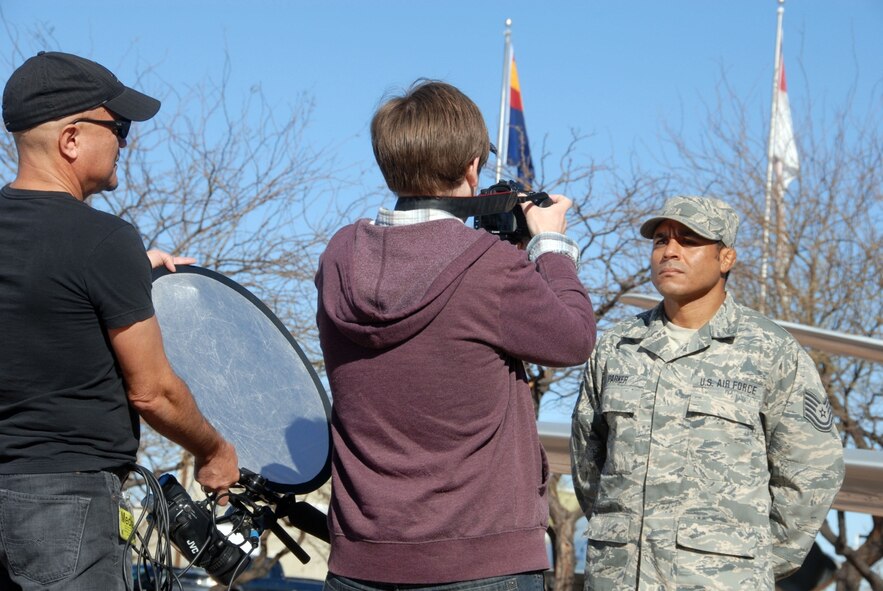 Local award-winning documentary artists Marcus De Leon and Brody Anderson capture images of Tech. Sgt. Michael Parker at the Tucson Air Guard Base during a recent Unit Training Assembly. (U.S. Air Force photo by Staff Sgt. Dina Farmer)