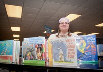 Emily Enderle, 23d Force Support Squadron library technician, poses for a photo Feb. 19, 2013, at the Moody Air Force Base, Ga., Library. Enderle has two sons, aged 9 and 12, and enjoys working with all children at the Moody Library. (U.S. Air Force photo by Senior Airman Jarrod Grammel/Released)
