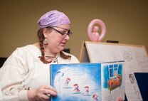 Emily Enderle, 23d Force Support Squadron library technician, reads to children during story time Feb. 19, 2013, at the Moody Air Force Base, Ga., Library. Enderle will earn her master’s degree in Library and Information Science in July 2013. (U.S. Air Force photo by Senior Airman Jarrod Grammel/Released)
