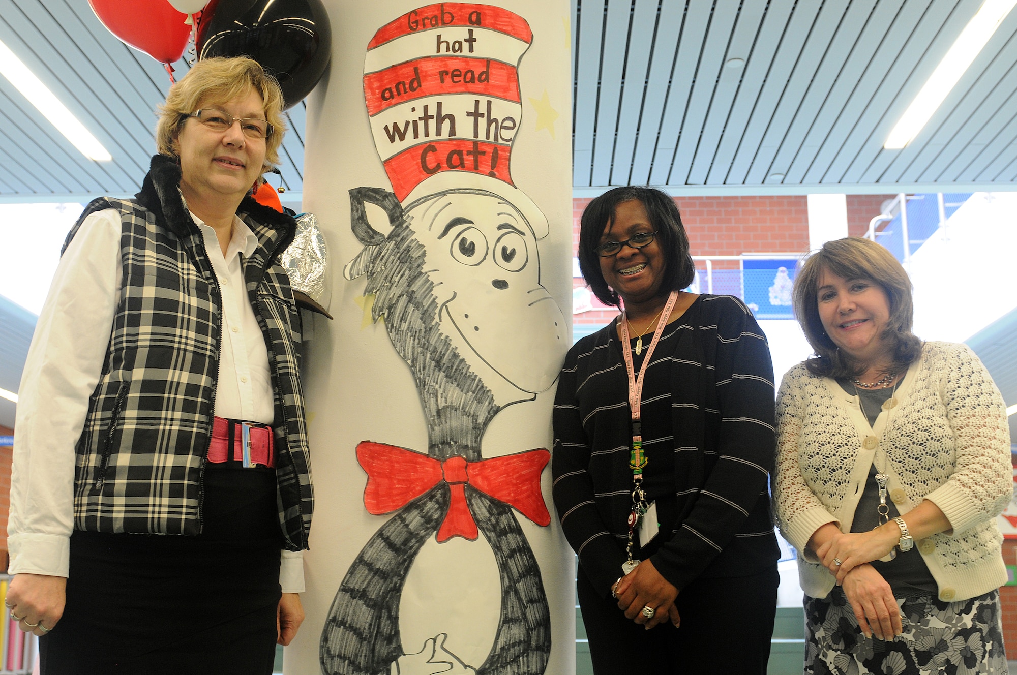 Marianne Warwick, Sonya Landner and Suzanne Laudar, Ramstein Elementary School first-grade teachers, organized Read Across America events for Ramstein Elementary School on Ramstein Air Base, Germany, Feb. 25, 2012. Entering its 16th year, Read Across America is a national event, also held at overseas military installations, to educate children of all ages about the importance of reading. (U.S. Air Force photo/Airman 1st Class Holly Cook)