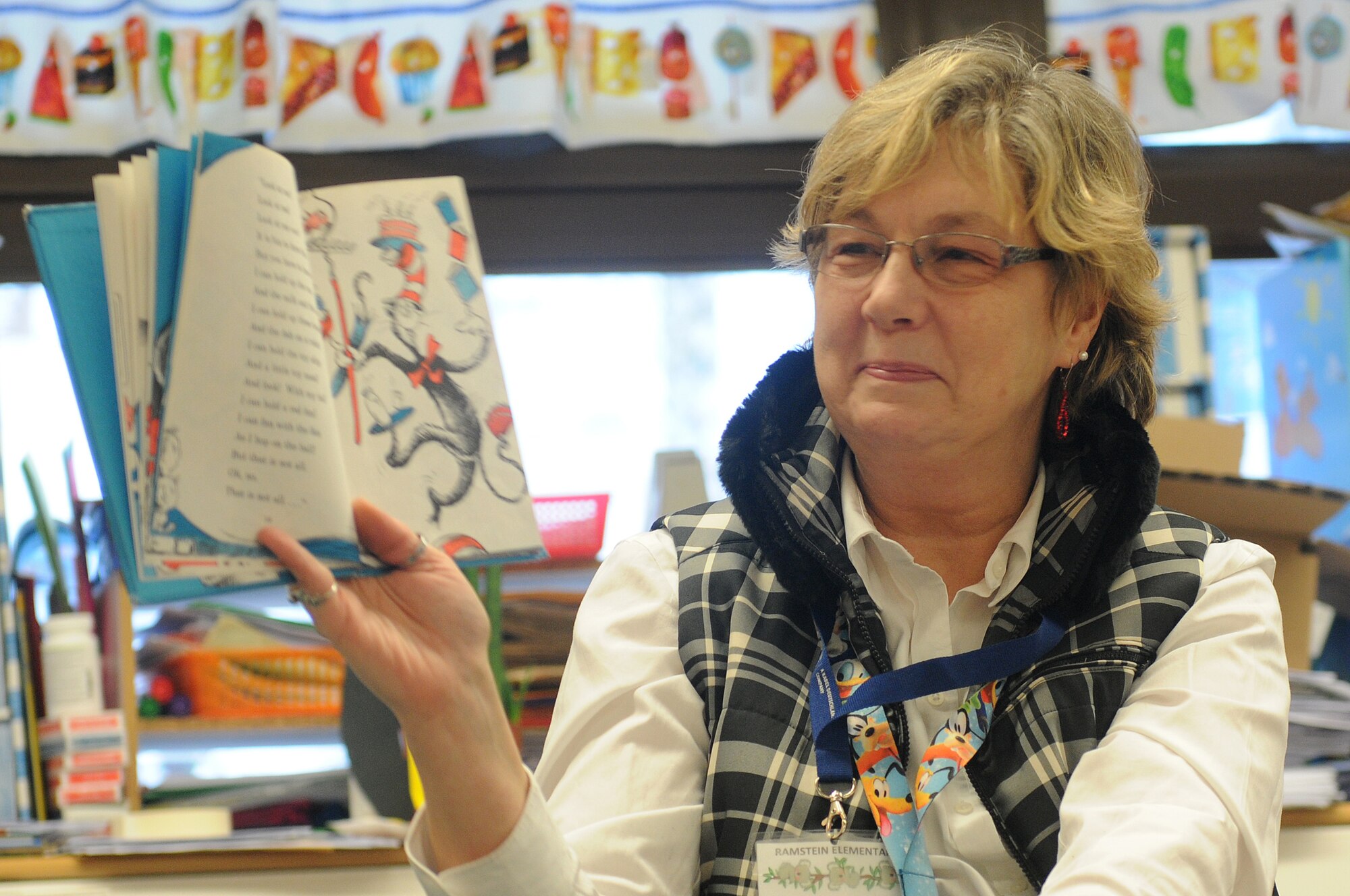 Marianne Warwick reads “The Cat in the Hat” to her first-grade class as part of Read Across America week at Ramstein Elementary School on Ramstein Air Base, Germany, Feb. 25, 2012. Entering its 16th year, Read Across America is a national event, also held at overseas military installations, to educate children of all ages about the importance of reading. (U.S. Air Force photo/Airman 1st Class Holly Cook)