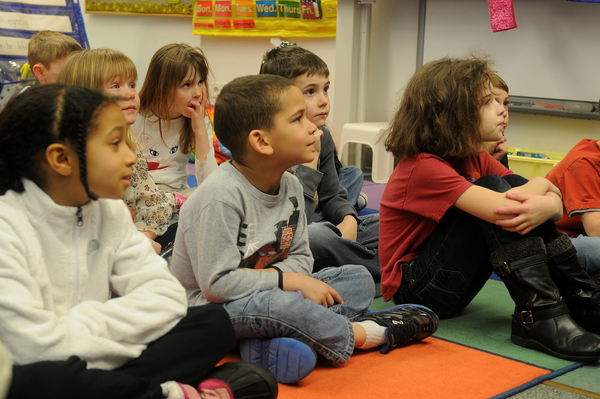 Students of Marianne Warwick’s first-grade class listen, as she reads “The Cat in the Hat” as part of Read Across America week at Ramstein Elementary School on Ramstein Air Base, Germany, Feb. 25, 2012. Entering its 16th year, Read Across America is a national event, also held at overseas military installations, to educate children of all ages about the importance of reading.(U.S. Air Force photo/Airman 1st Class Holly Cook)