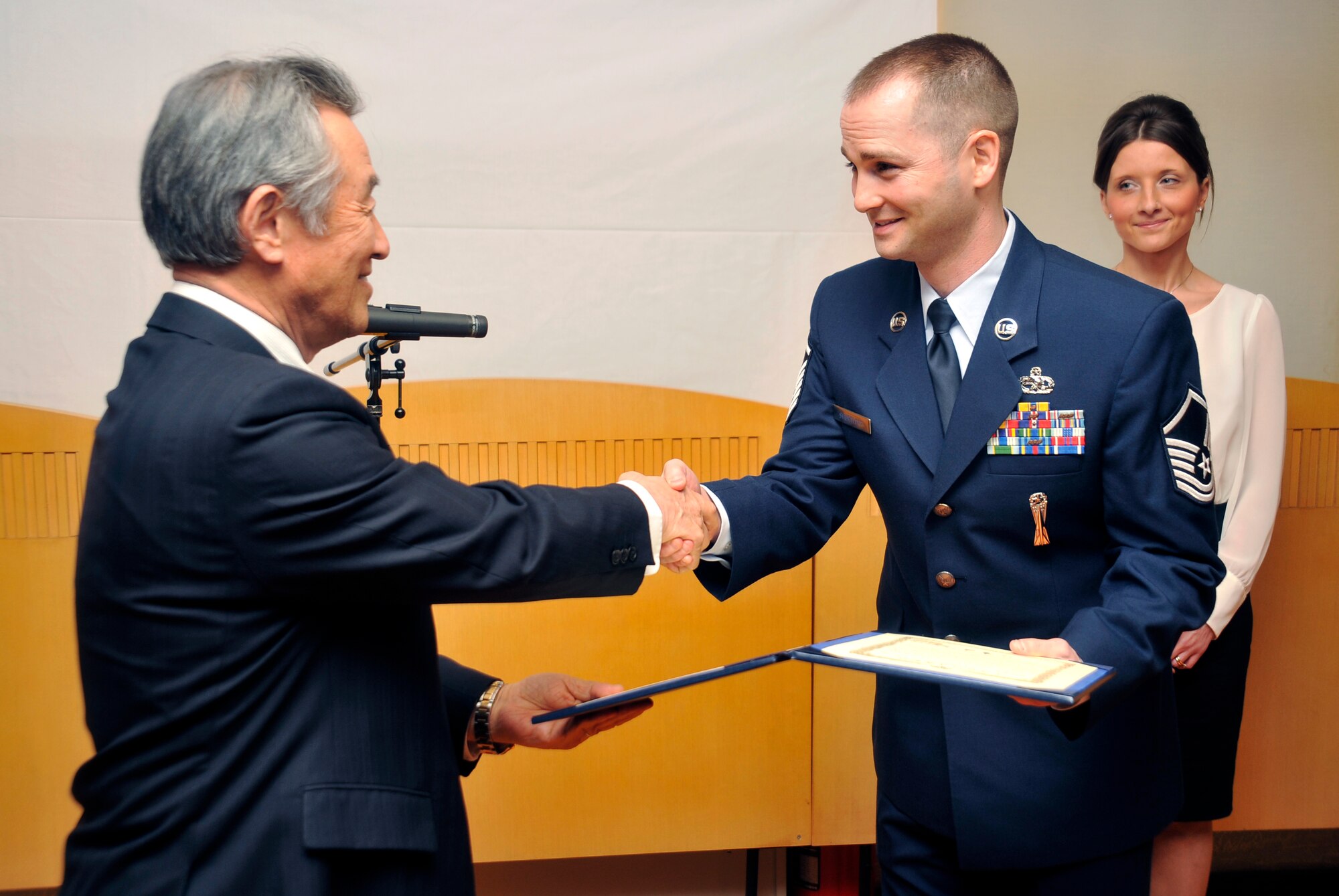 U.S. Air Force Master Sgt. Brian Shurtleff, 35th Maintenance Squadron weapons maintenance NCO in charge, receives a Japan-America Air Force Goodwill Association award from retired Japan Air Self-Defense Force Lt. Gen. Seiji Kagawa, JAAGA vice president, at Misawa Air Base, Japan, Feb. 22, 2013. Shurtleff received the award for his outstanding bilateral efforts in Calendar Year 2012. (U.S. Air Force photo by Airman 1st Class Zachary Kee)