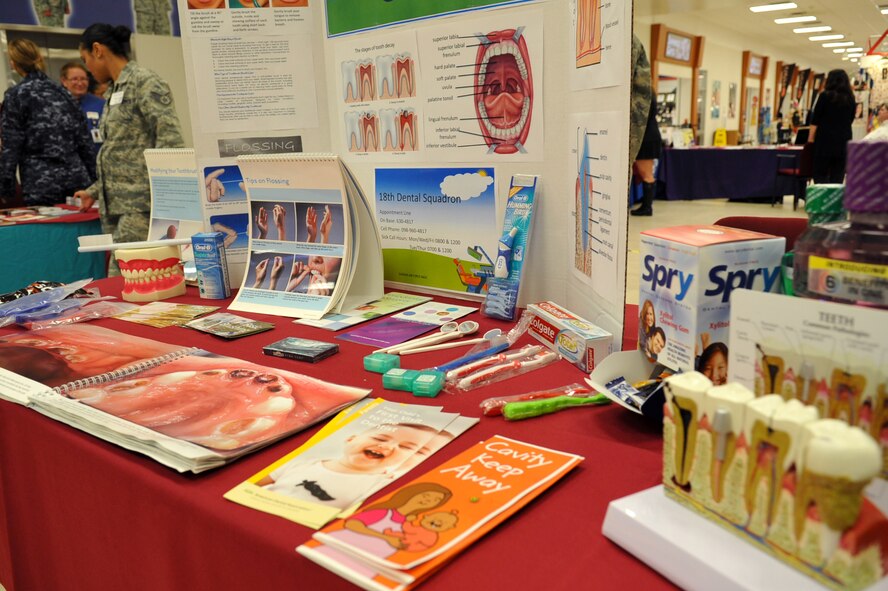 U.S. Naval Hospital Okinawa personnel displayed dental health information during a Joint Health Promotion Fair on Kadena Air Base, Japan, Feb. 21, 2013. Along with representatives from the hospital, similar organizations such as the 18th Medical Group provided advice to service members and families.  (U.S. Air Force photo/Naoto Anazawa)