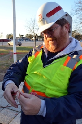 Kevin Ewbank, Rock Island District park ranger, looks at an ornament made by students from a local school in Staten Island near Midland Beach before placing it back on the “Tree of Hope,” Dec. 23. Ewbank is part of the Corps’ Critical Incident Stress Management team trained to respond to a crisis and provide support to volunteers, family and friends.