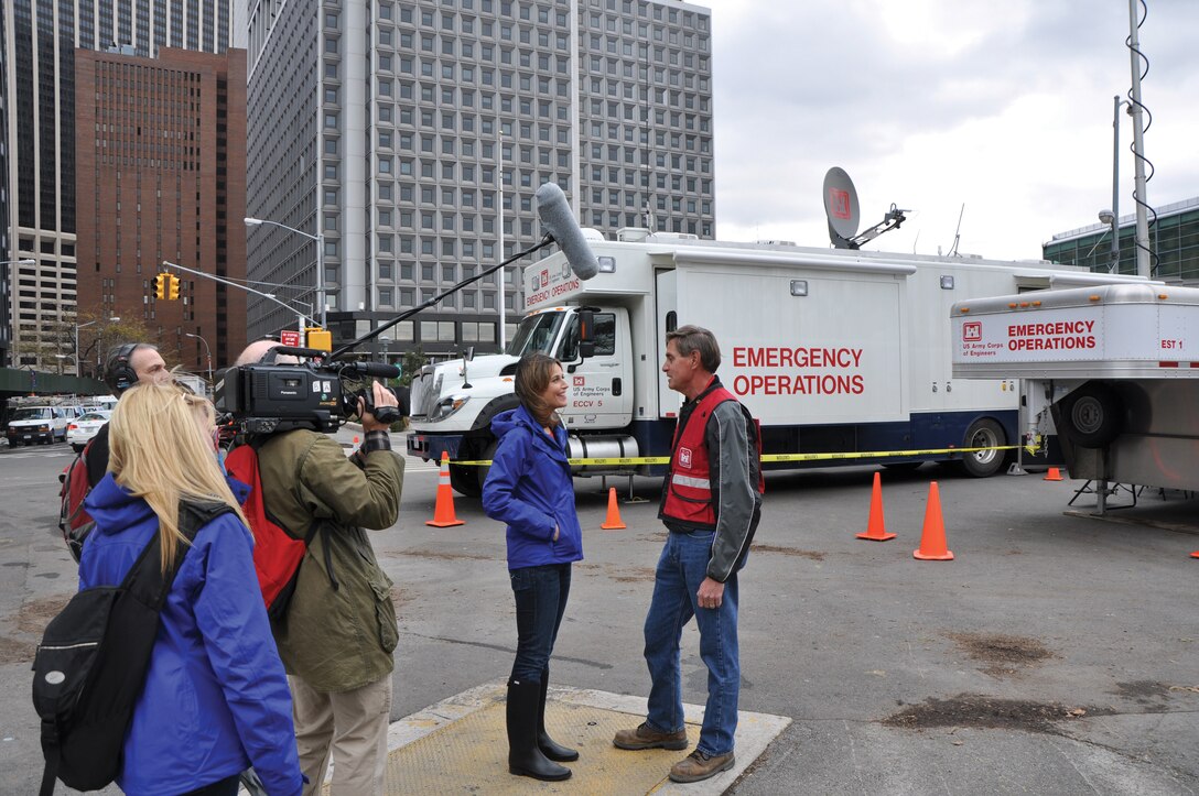 Roger Less, chief, Design Branch, is interviewed by Savannah Guthrie from NBC’s TODAY show for an update on unwatering New York City’s transporation tunnels . In the background is the Corps Deployable Tactical Operations System at Battery Park that served as the team’s office.