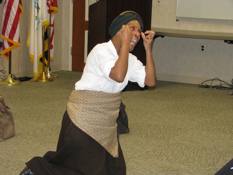 Gwendolyn Brilley-Strand portrays "Harriet Tubman: The Chosen One" in her performance for federal employees at the City Crescent Building in Baltimore, Md., on Feb. 26, as part of the U.S. Army Corps of Engineers, Baltimore District, observance of African American Black History Month. 