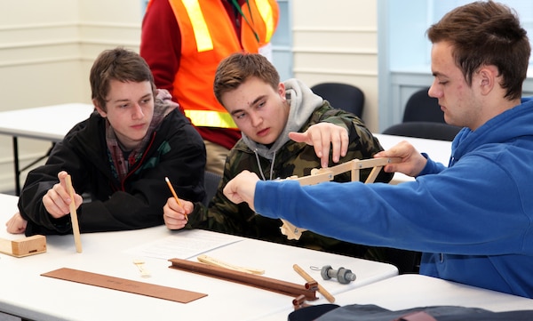 High school students from a dozen Portland-area schools visited Bonneville Lock and Dam Feb. 21, 2013, to celebrate Engineer Day. Students learn about structural engineering during a bridge-building exercise.