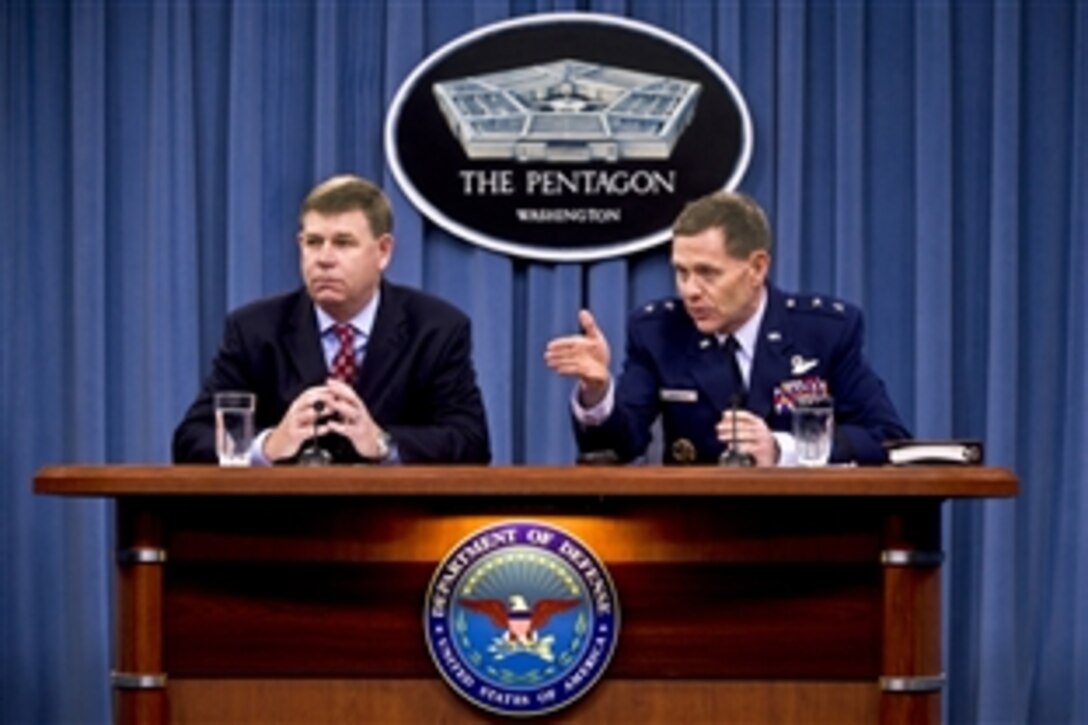 Air Force Maj. Gen. Robert E. Wheeler, the Defense Department's deputy chief information officer for command, control, communications and computers and information infrastructure capabilities, and John Hickey, program manager for mobility for Defense Information Systems Agency, brief reporters on its mobile device policy at the Pentagon, Feb. 26, 2013.