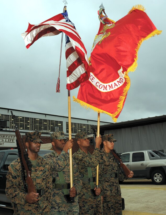 Marines with Marine Corps Logistics Command practice precision color guard movements recently in front of Marine Depot Maintenance Command.