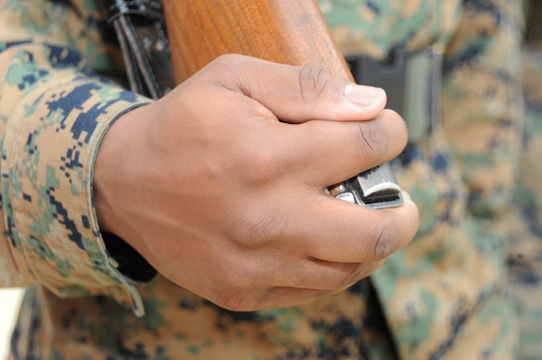 Marines with Marine Corps Logistics Command practice precision color guard movements recently in front of Marine Depot Maintenance Command.