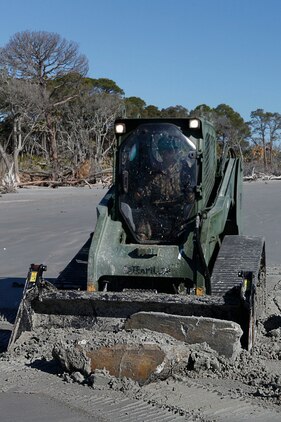 Lance Cpl. Jordan Wolfe, Marine Wing Support Squadron 273 heavy equipment operator, uses a multi-terrain loader to remove concrete on the Hunting Island beach, Feb. 20. The squadron is currently conducting an Engineer Company Community Relations Project on Hunting Island State Park to help improve the beach’s appearance and saftey.