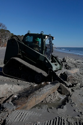 Lance Cpl. Jordan Wolfe, Marine Wing Support Squadron 273 heavy equipment operator, uses a multi-terrain loader to remove concrete on the Hunting Island beach, Feb. 20. The squadron is currently conducting an Engineer Company Community Relations Project on Hunting Island State Park to help improve the beach’s appearance and saftey.