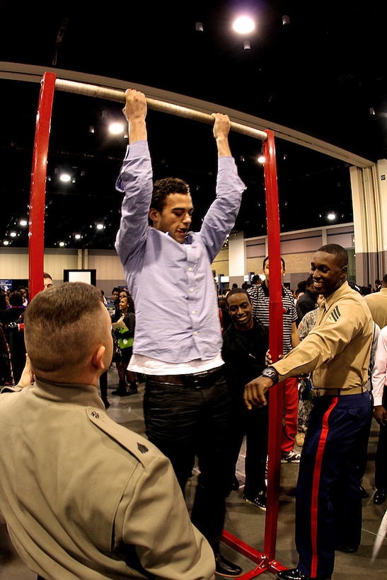 CHARLOTTE, N.C.—Marines from 6th Marine Corps District conduct a Marine Corps Pull-up Challenge during the National Education Association Career Day at the Charlotte Convention Center.
 
The NEA Career Day was one of the many events benefitting the community during the week of the Central Intercollegiate Athletic Association’s Basketball Tournament.

The Central Intercollegiate Athletic Association (CIAA) was founded in 1912 as the Colored Intercollegiate Athletic Association, and is the oldest African-American athletic conference in the Nation. The CIAA is touted as being the third most attended basketball tournament among all NCAA divisions, and consists of Historically Black Colleges and Universities (HBCU) spanning the East Coast from Pennsylvania to North Carolina.     

The 2013 CIAA Tournament is expected to bring about 190,000 fans to Charlotte, N.C., during the course of the week with an economic impact exceeding $40 million. 

Marines from across the Nation were brought to Charlotte during the 2013 CIAA tournament to raise awareness of the Marine Corps' Officer programs to the participants and attendees of the tournament as a viable option for college graduates after they transition from college to professional life. (Official USMC photo by Staff Sgt. Tracie G. Kessler)
