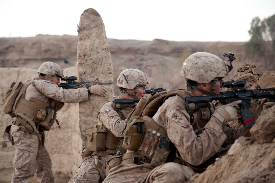 U.S. Marines assigned Ripper Mobile Assault Platoon (RMAP), Headquarters Company, Regimental Combat Team 7, provide security during a firefight at village stability platform (VSP) Shurakay, Helmand province, Afghanistan, Feb. 16, 2013. The Marines of RMAP were supporting Operation Dynamic Partnership, a multi-unit collaboration to retrograde all U.S. military equipment and personnel from VSP Shurakay. (U.S. Marine Corps photo by Cpl. Alejandro Pena/Released)